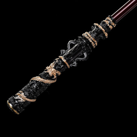Close-up of the gold-engraved Chinese characters 如意金箍棒 on the staff body, etched in vibrant purple-gold against a black-gold finish

QQzsjgb
