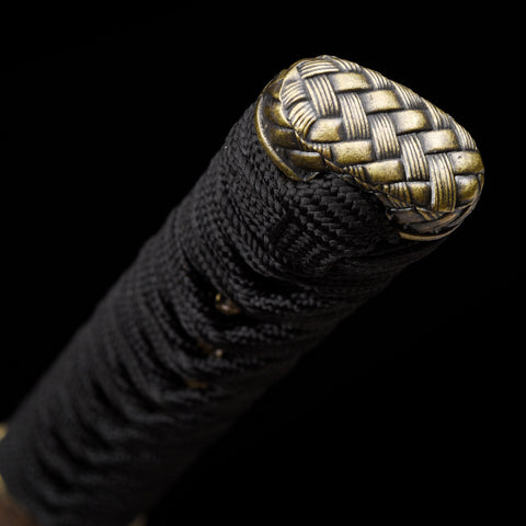 Close-up of the Wakizashi blade showcasing its clay-tempered hamon pattern

