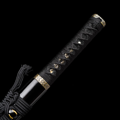 Full-length Wakizashi displayed on a stand, highlighting its craftsmanship

