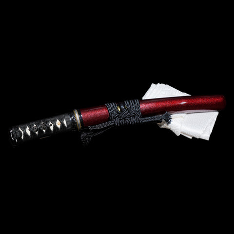 Dark red shimmering saya paired with an alloy tsuba, highlighting the craftsmanship of the hand-forged Japanese tanto sword.