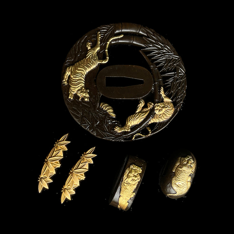 Copper Tsuba gilded with gold and silver. 