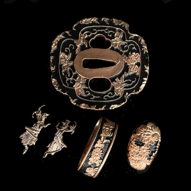 Copper Tsuba gilded with gold and silver. 