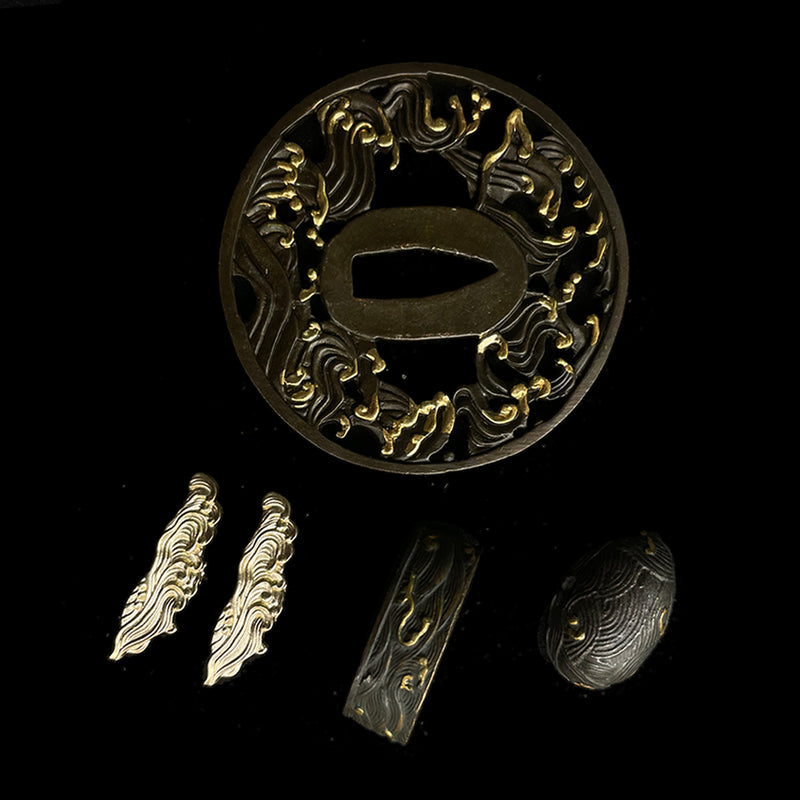 Copper Tsuba gilded with gold and silver. 