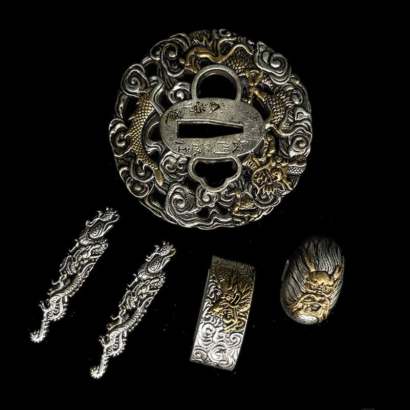 Copper Tsuba gilded with gold and silver. 