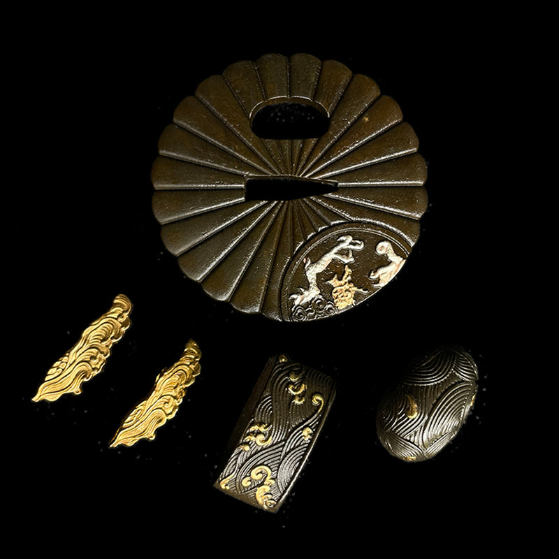 Copper Tsuba gilded with gold and silver. 