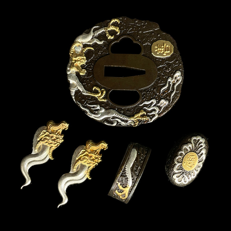 Copper Tsuba gilded with gold and silver. 