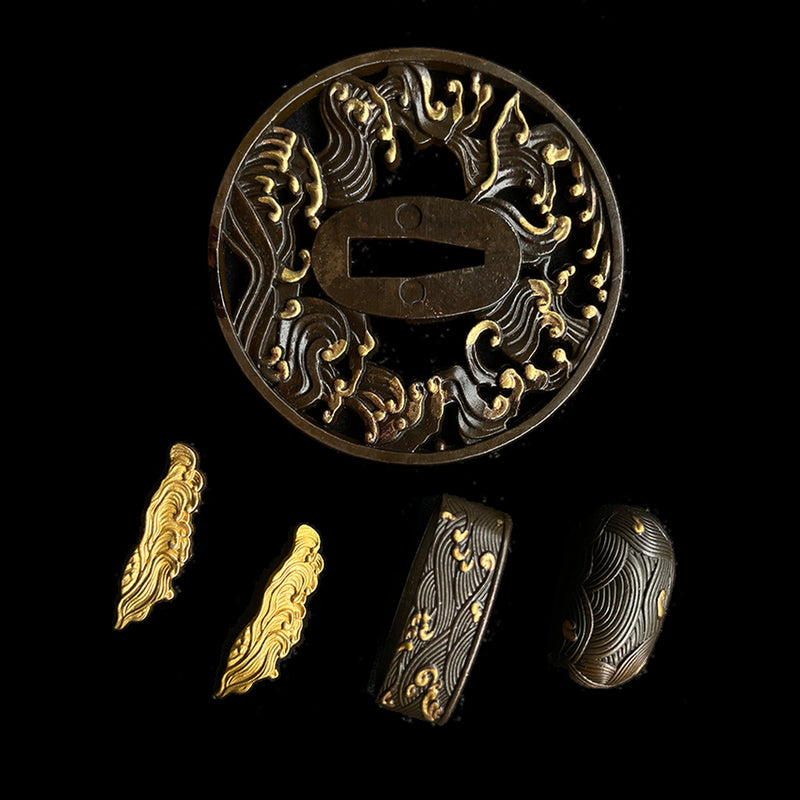 Copper Tsuba gilded with gold and silver. 