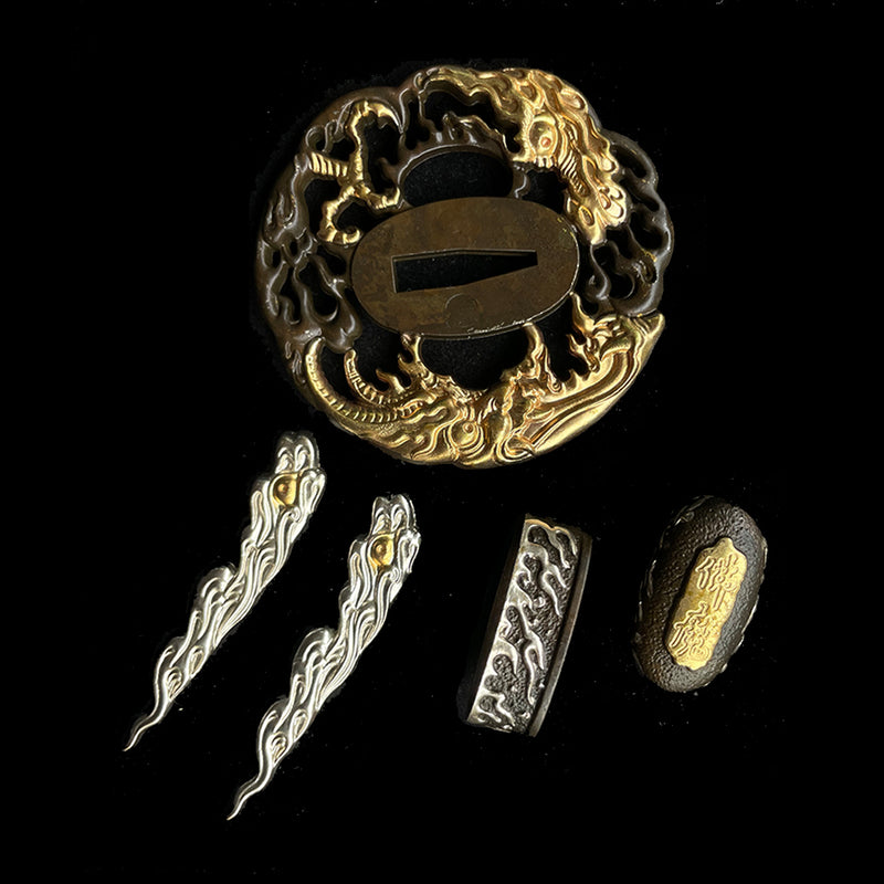 Copper Tsuba gilded with gold and silver. 